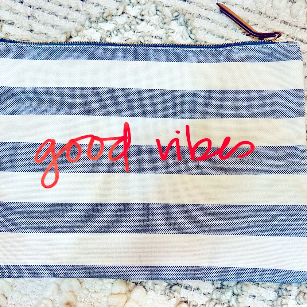 “Good vibes” striped clutch